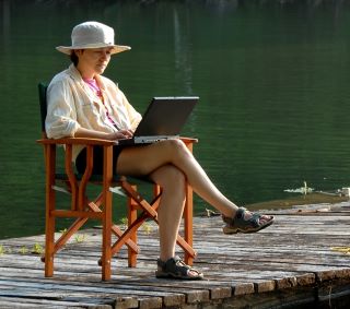 woman dock jetty relaxed work life balance